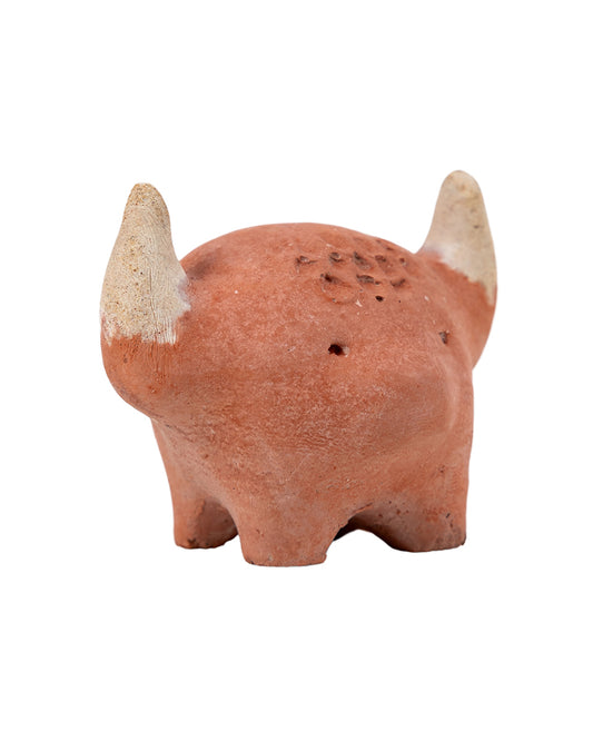 A concrete figurine of a Highland Cow, with an orangy-brown finish, designed to relieve stress.