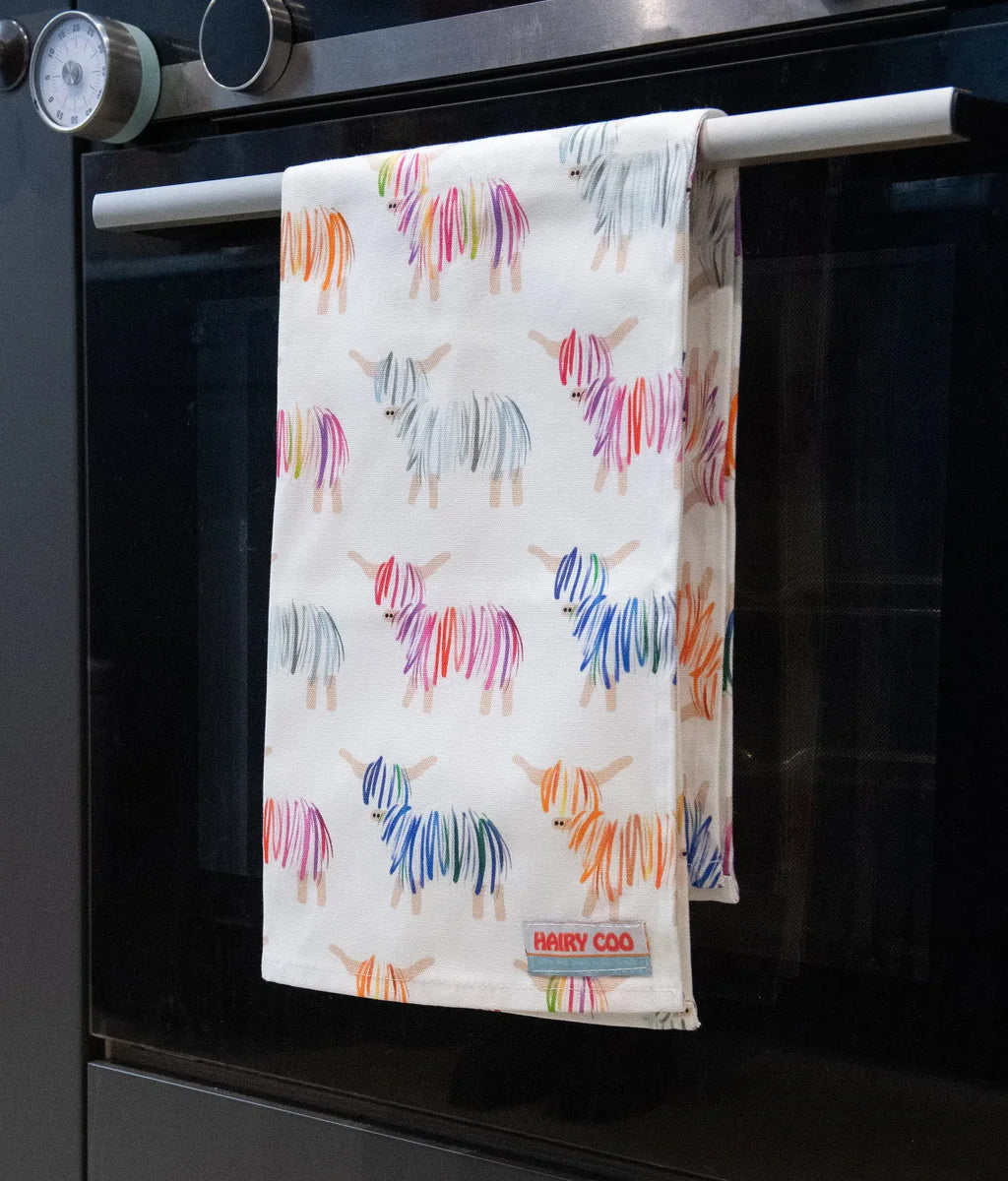 Hairy Coo Highland Cow Tea Towel Hanging on oven door handle