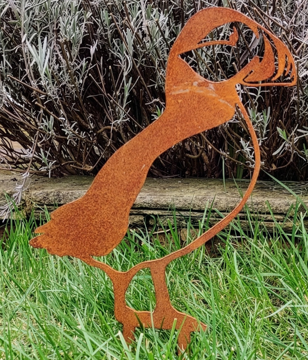Rusted Puffin Ground Spike set on a grass patch