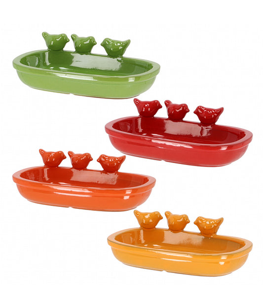 Ceramic bird feeders in green, red, orange, and yellow on a white background.