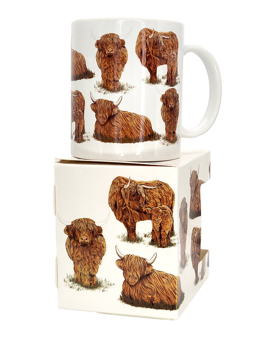 Mug and box with highland cow design on a white background