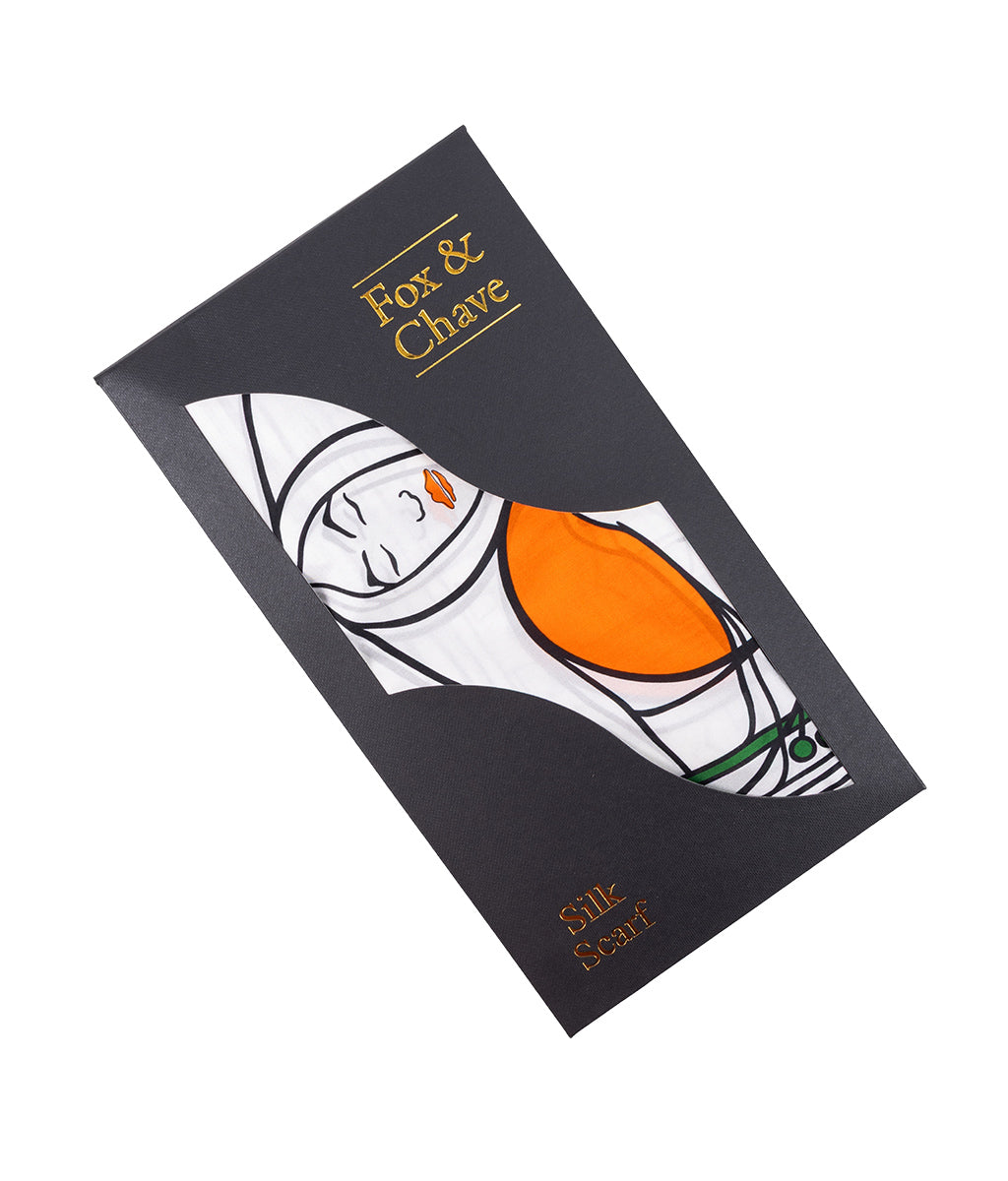 Silk scarf packaging with 'Fox & Chave' branding on a white background