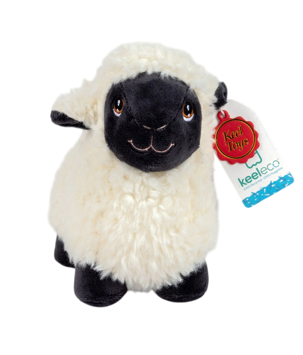 Plush sheep toy with a Keeleco tag on a white background