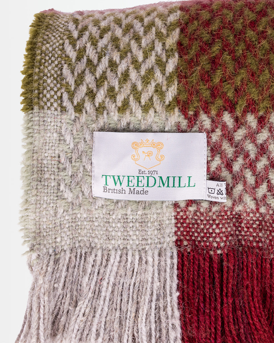 Woven fabric with a Tweedmill label on a white background