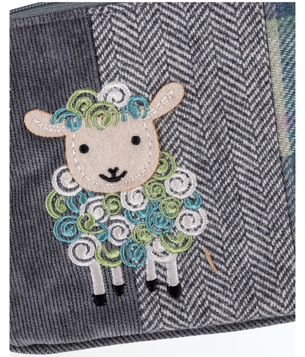 Meadow Tweed Sheep Purse with a sheep design on a white background