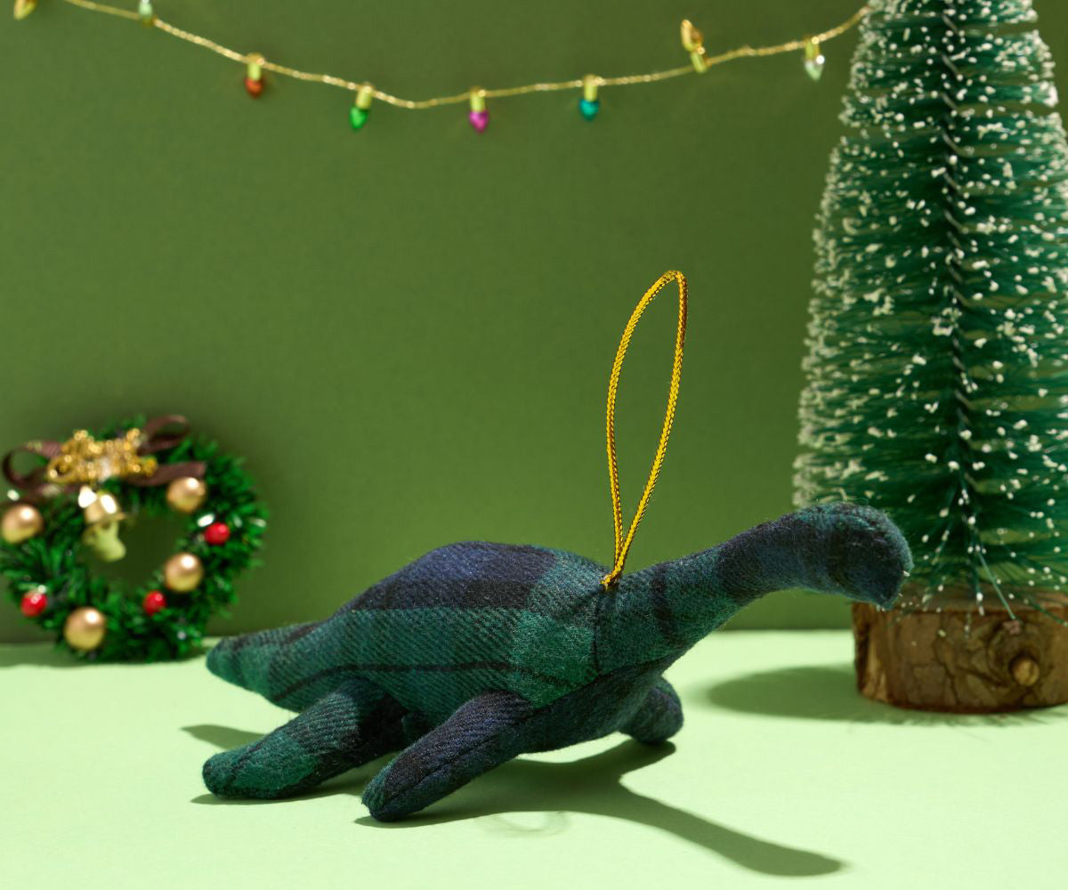 Knitted Nessie Loch Ness Monster hanging decoration with a Christmas grren coloured scene