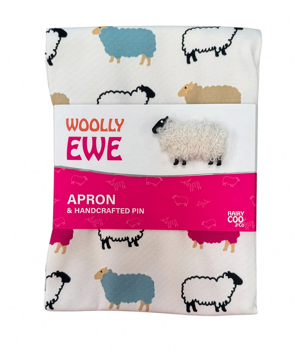 Woolly Ewe apron and handcrafted pin set with sheep pattern on packaging