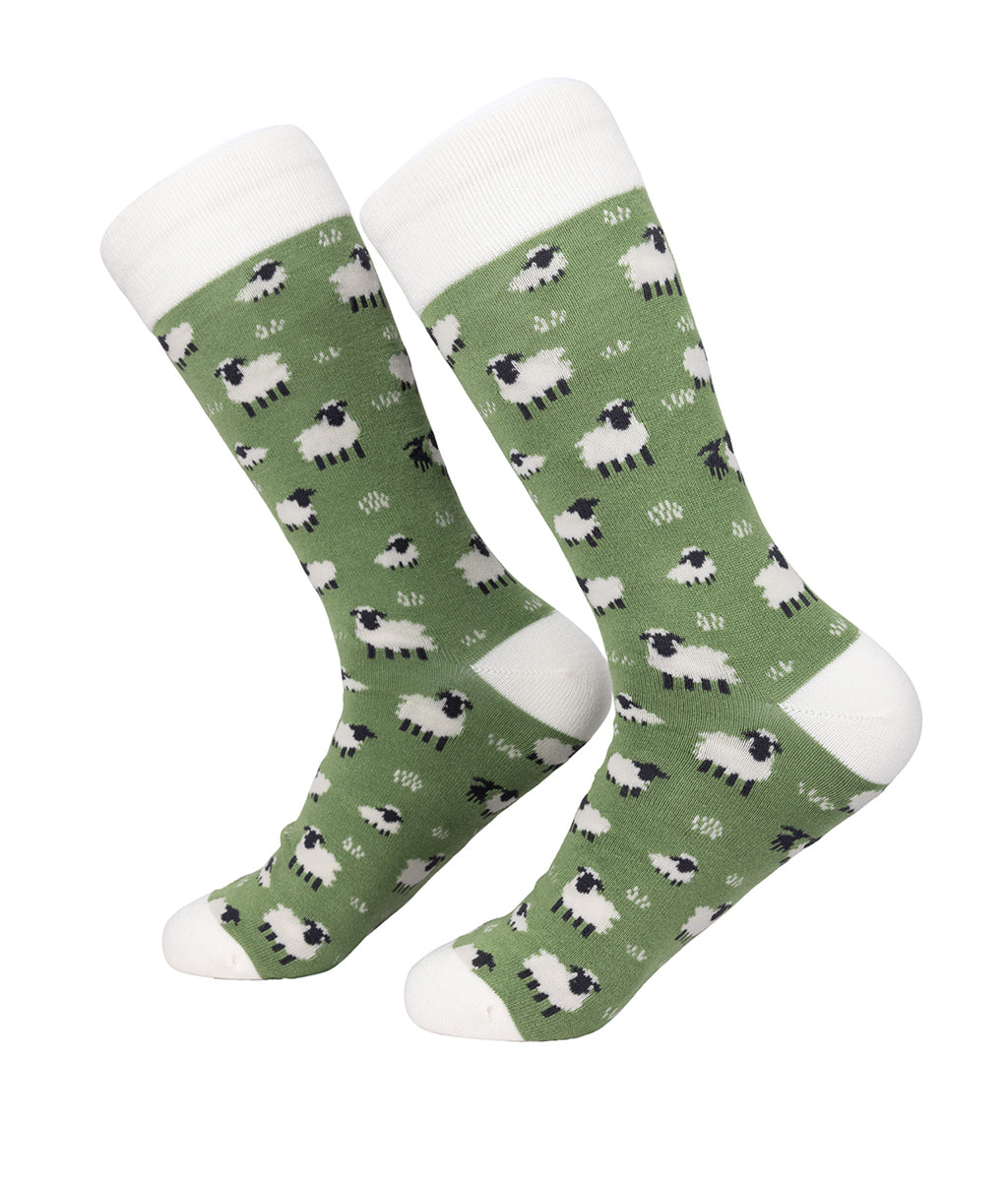 Green socks with sheep pattern on a white background