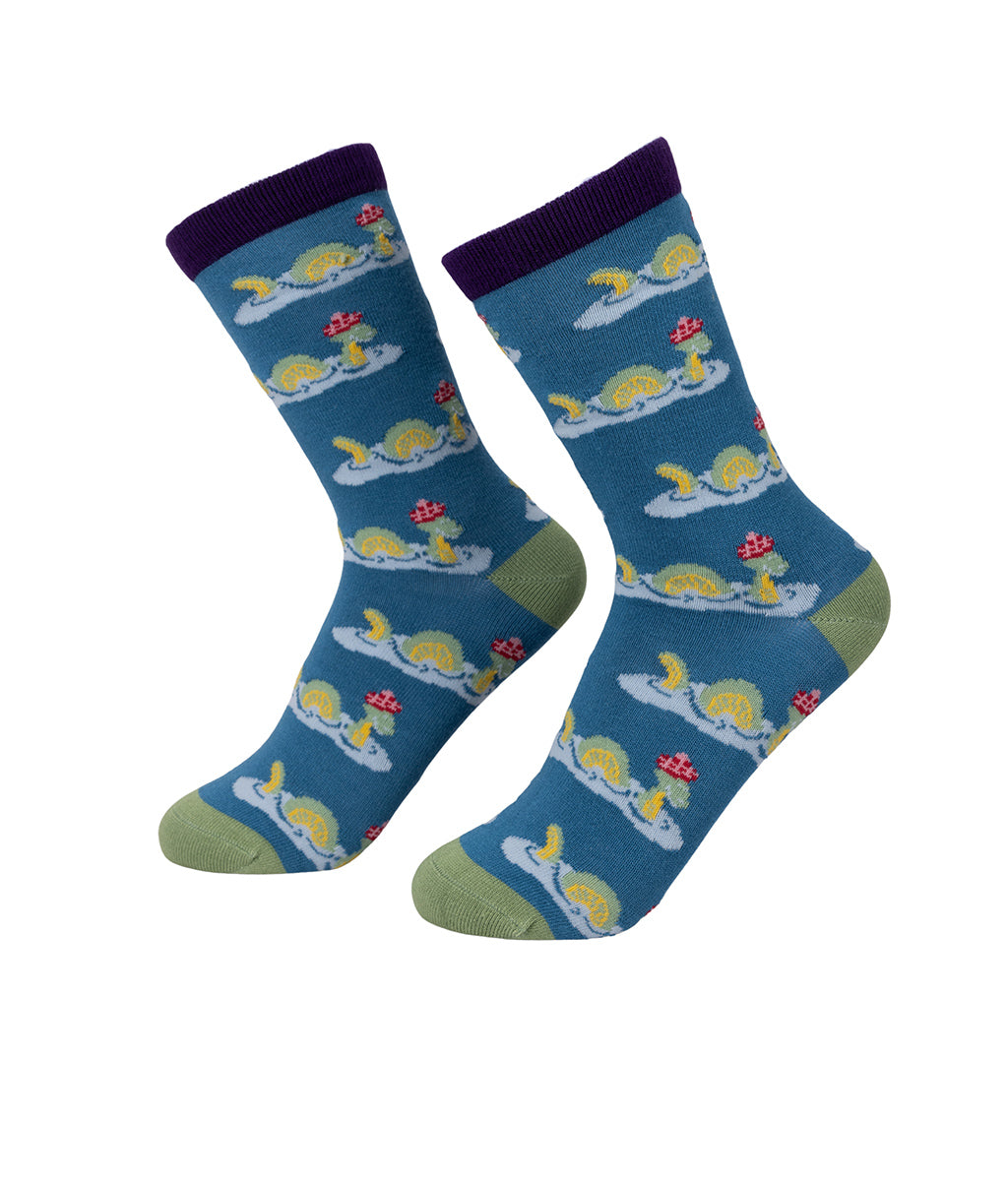 Kids blue socks with a Nessie - Loch Ness Monster design and National Trust for Scotland packaging on a white background