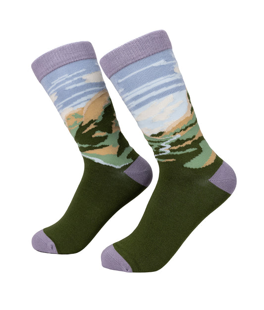 Pair of socks with a Glencoe landscape design on a white background
