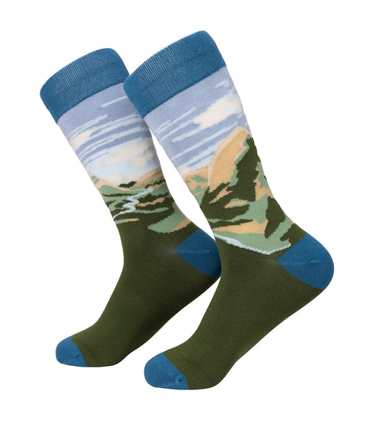 Pair of socks with a Glencoe landscape design on a white background