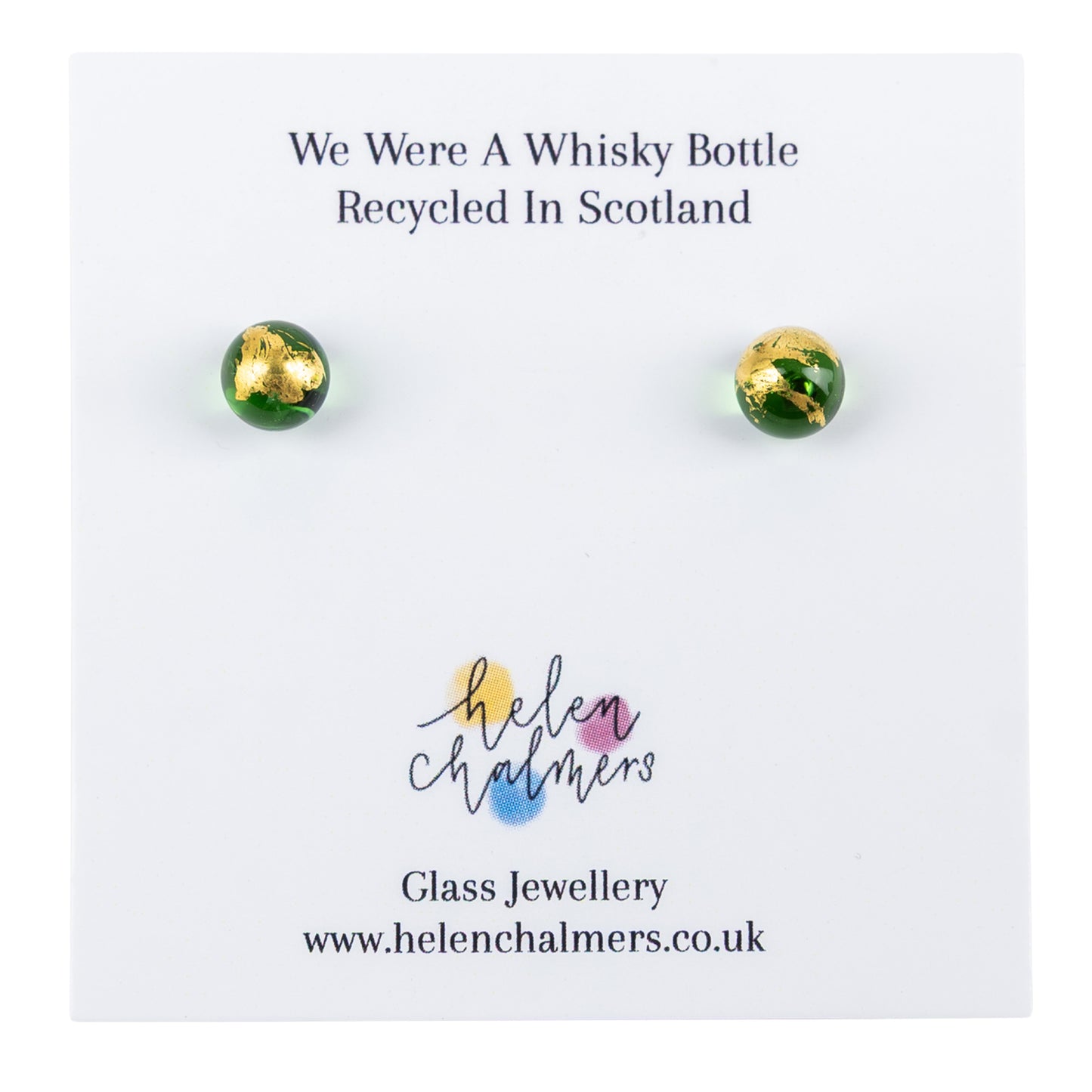 A pair of recycled whiskybottle green glass and gold stud earrings, displayed on a white backing card from Helen Chalmers.