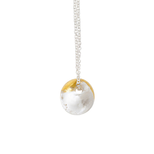 A recycled whisky bottle clear glass and gold pendant on Sterling Silver Chain featuring a clear glass and gold finish, shown against a plain white background.
