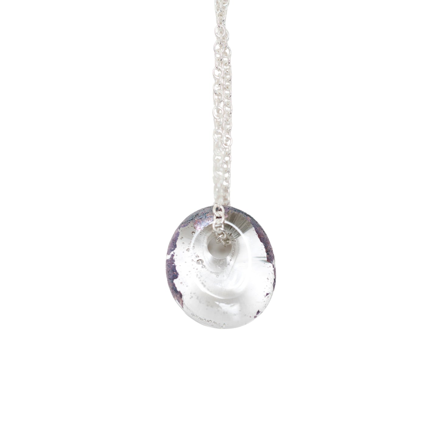A recycled whisky bottle clear glass and palladium pendant on Sterling Silver Chain against a solid white background.