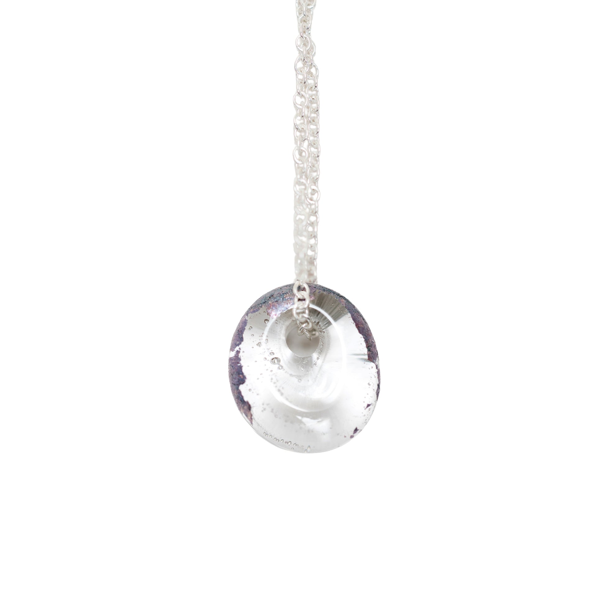A recycled whisky bottle clear glass and palladium pendant on Sterling Silver Chain against a solid white background.