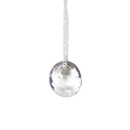A recycled whisky bottle clear glass and palladium pendant on Sterling Silver Chain against a solid white background.