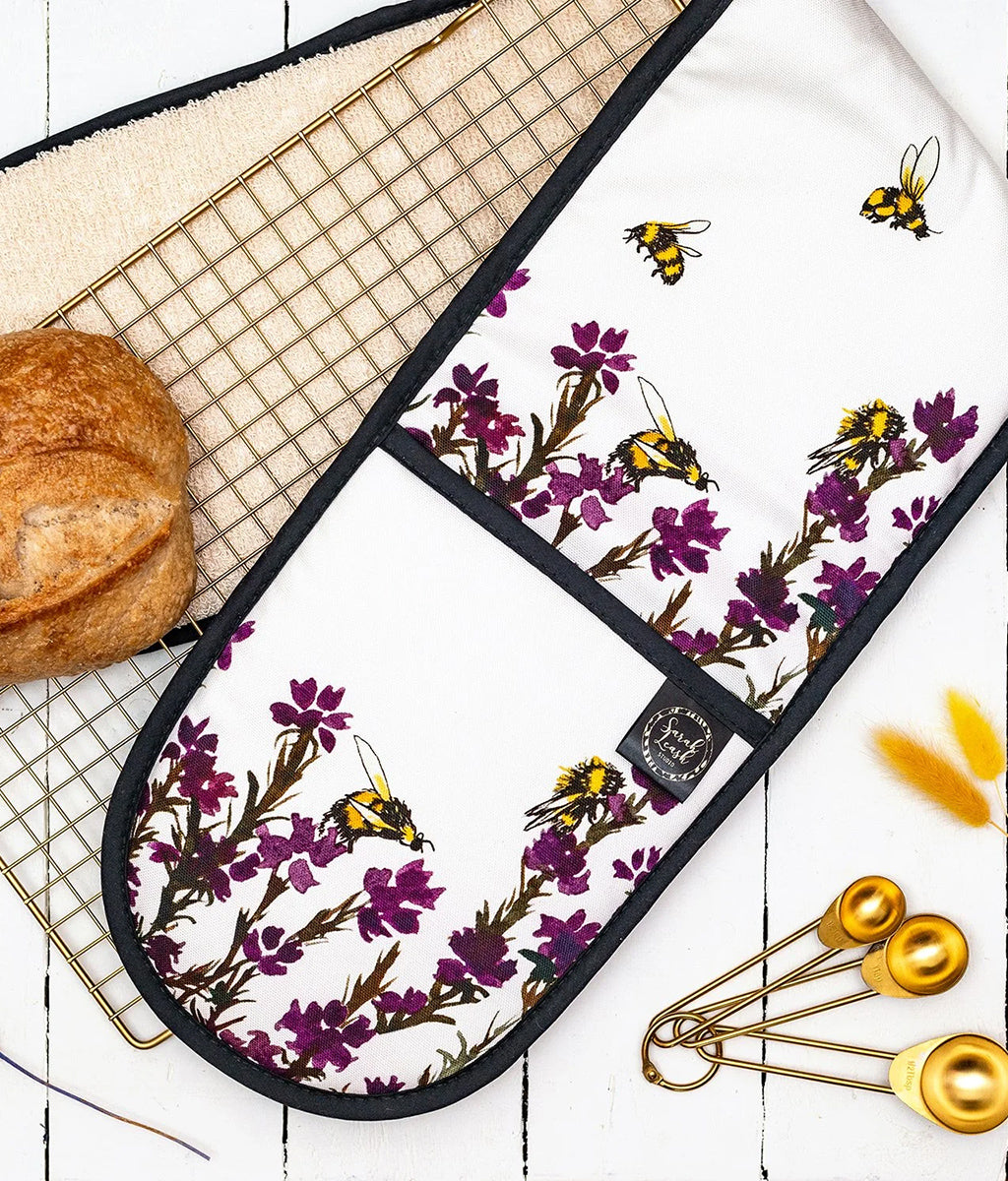 Heather & Honey Oven Gloves by Sarah Leask on a counter top