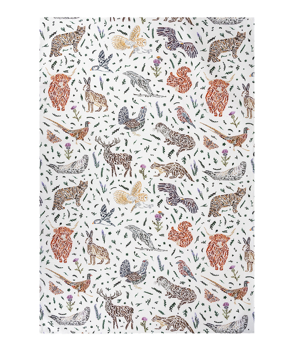 Wildlife Tea Towel by Sarah Leask featuring patterned fabric with animals and plants on a white background
