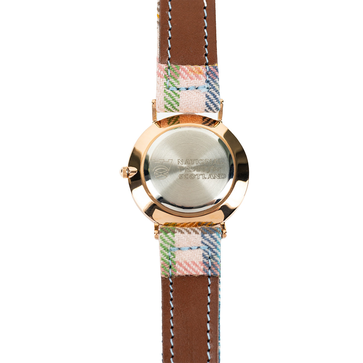Wristwatch with a plaid strap and rose gold casing on a white background