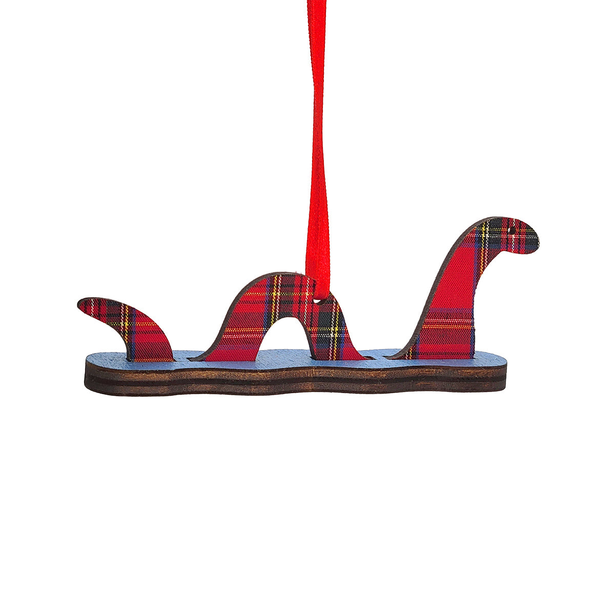 A Scottish Highlands 'Loch Ness' monster Christmas ornament made of layered wood with a red tartan plaid pattern and a red hanging ribbon, shown on a plain white background.