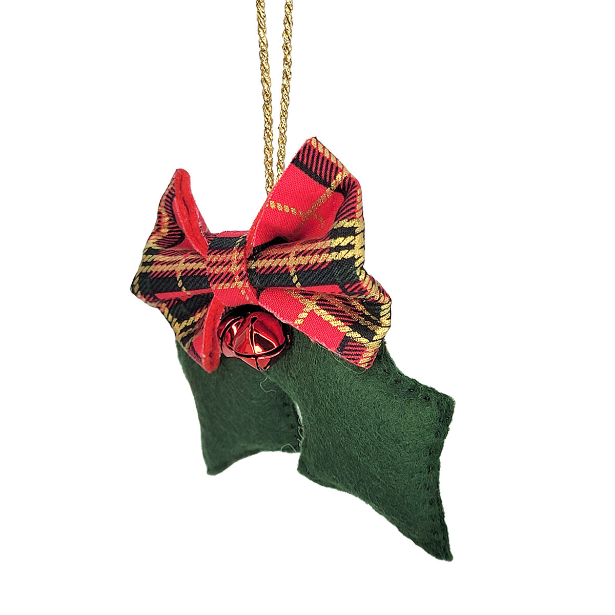 A Christmas ornament shaped like holly leaves, featuring dark green felted fabric leaves, a red and black plaid fabric bow, and small red sleigh bells, hanging from a gold-colored string on a white background.