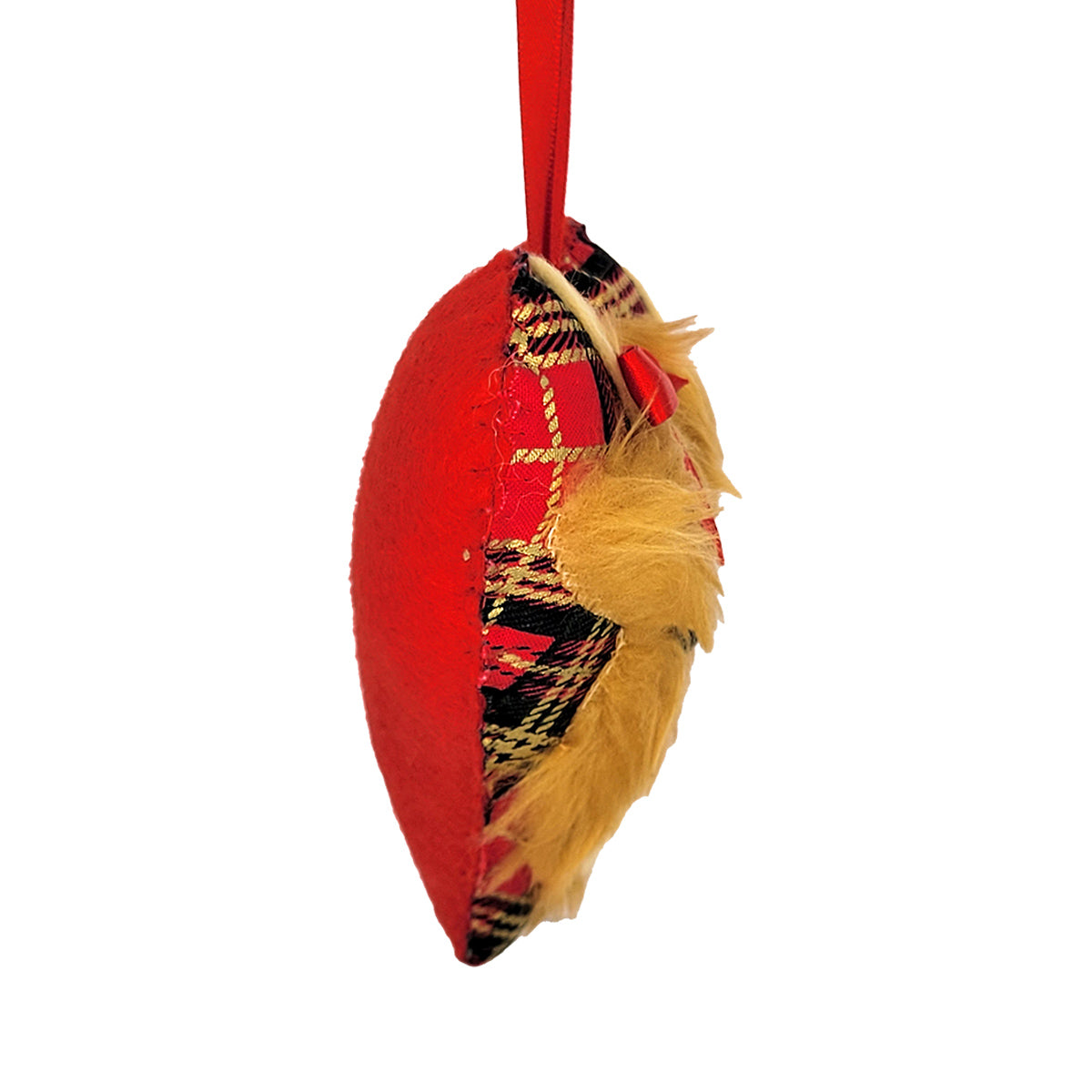 A red fabric ornament shaped like a heart, featuring a red and dark green tartan plaid pattern on one side, a fluffy Highland Cow face faux-fur, and a red hanging loop at the top, shown against a plain white background. 