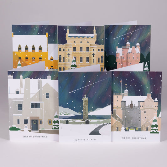 Christmas Cards Inspired by the Northern Lights. Six Christmas greeting cards arranged in two rows on a light gray background. Designed by Hole in my Pocket