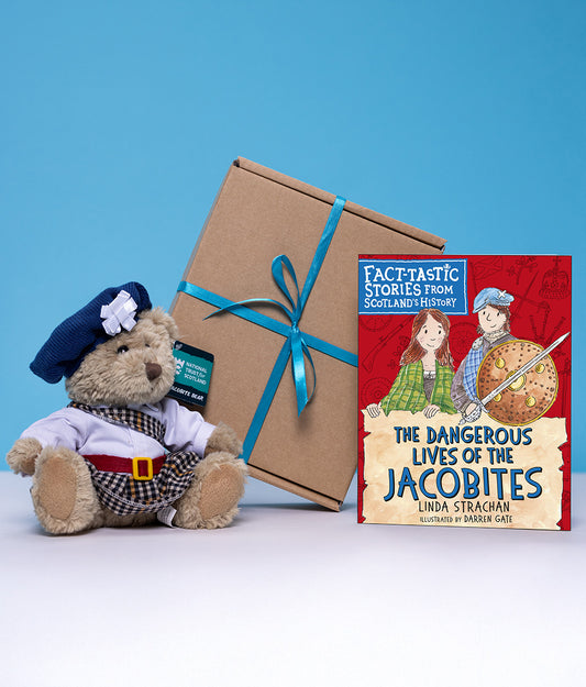 Teddy bear in Jacobite costume with a gift box and children's book titled 'The Dangeroud Lives of the Jacobites' on a blue background