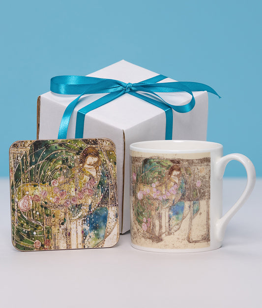Mug and coaster set with Sleeping Princess design on a white box tied with a blue ribbon against a blue background