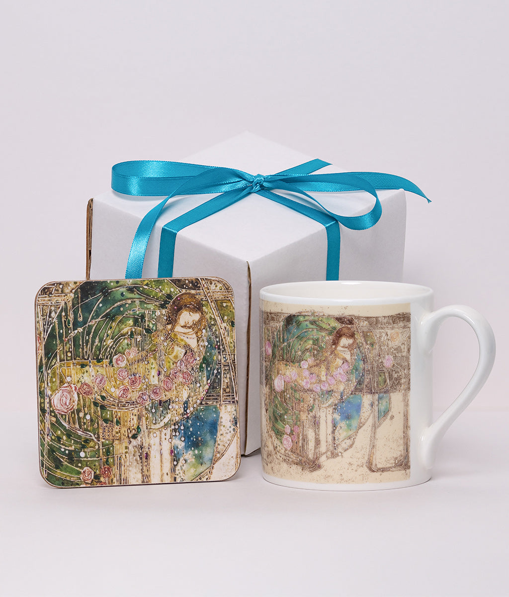 Mug and coaster set with Sleeping Princess design on a white box tied with a blue ribbon against a white background