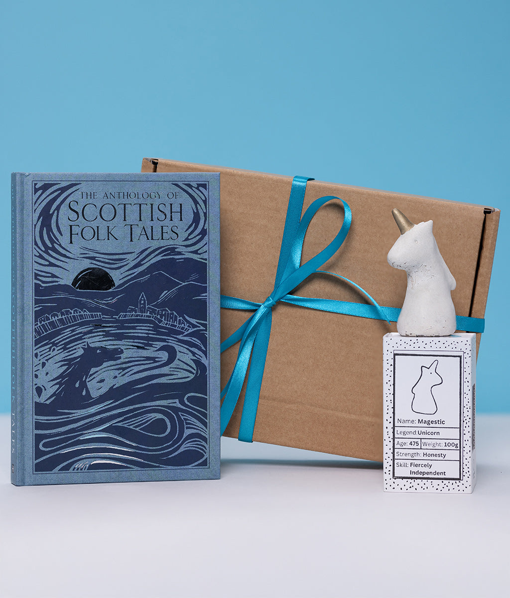 Book titled 'The Anthology of Scottish Folk Tales' with a gift box and decorative worrywart on a blue background