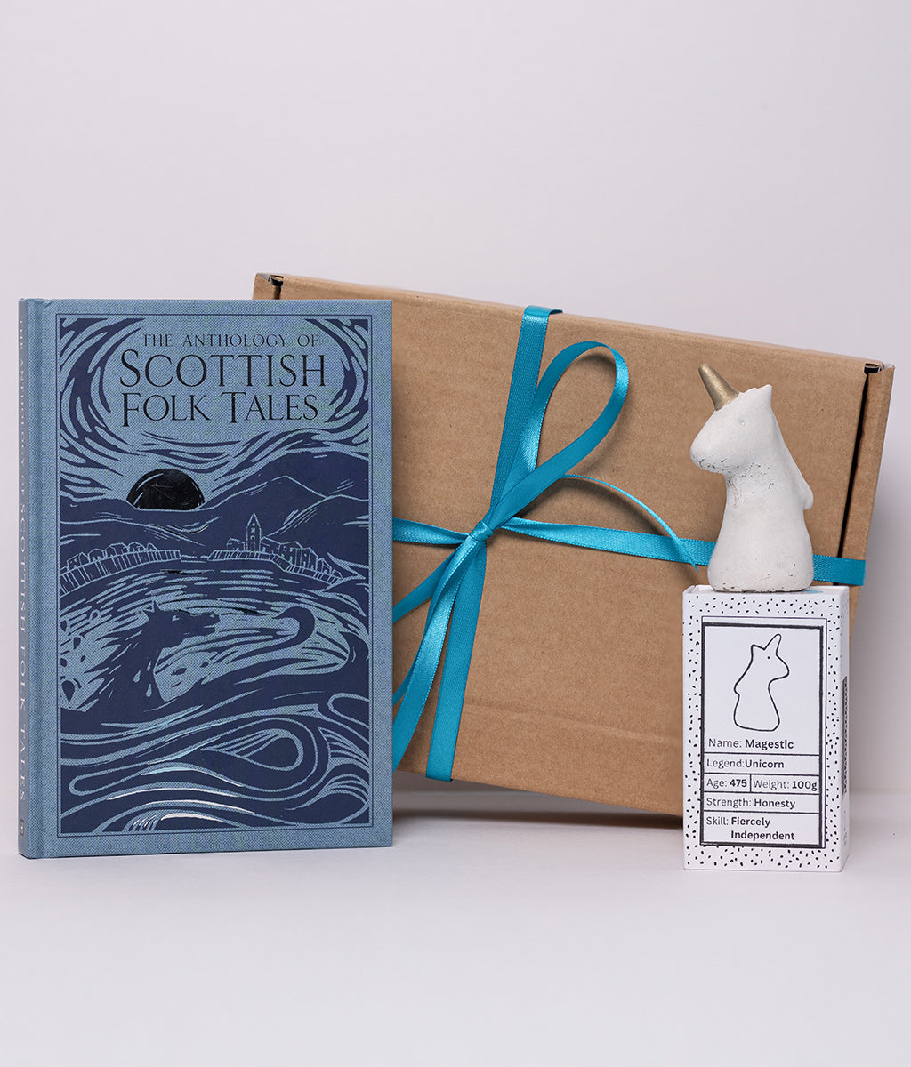 Book titled 'The Anthology of Scottish Folk Tales' with a unicorn-shaped object and box on a white background