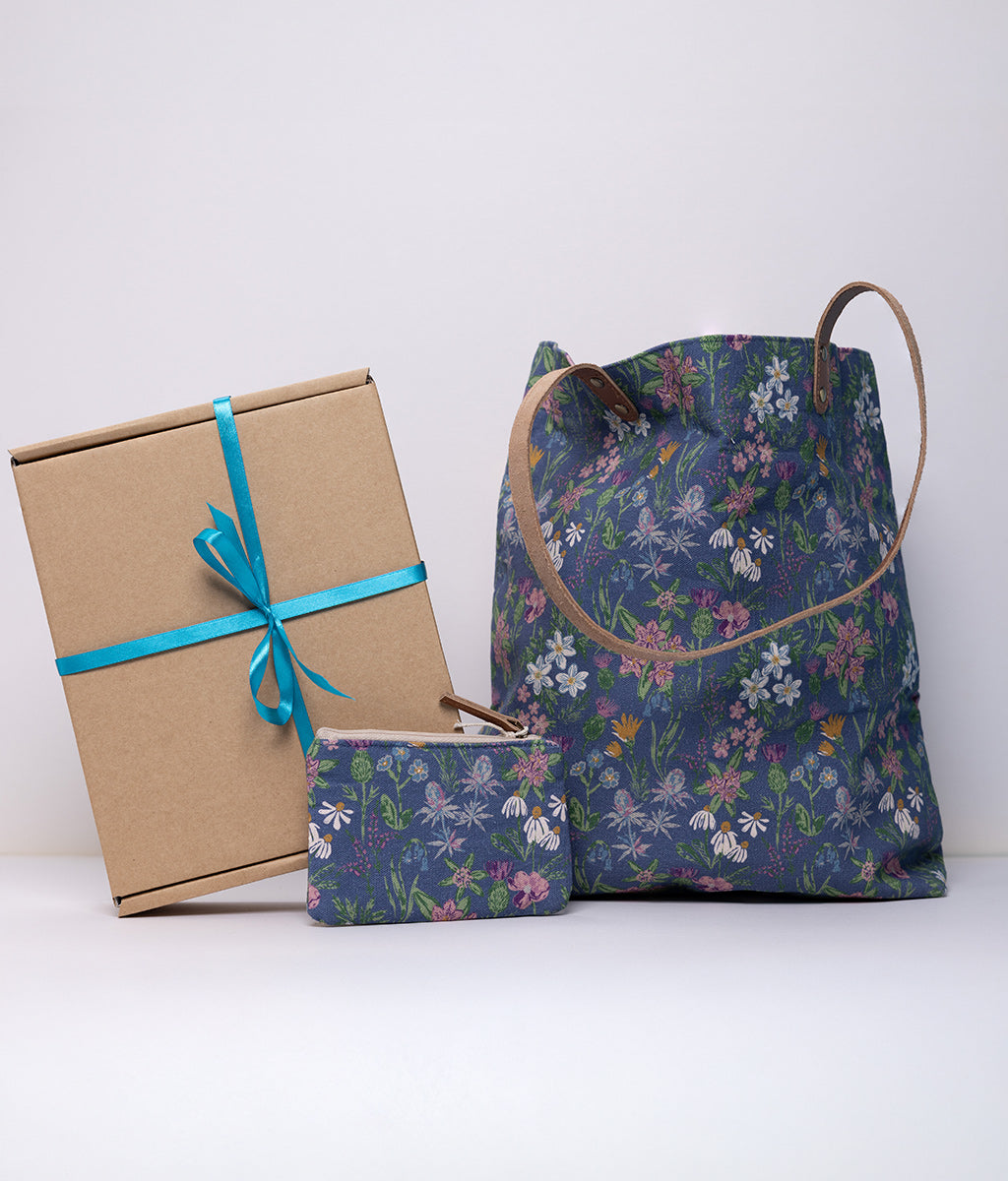 Wild Flower Purse & Bag Gift Box. Floral-patterned bag and gift box with blue ribbon on a white background
