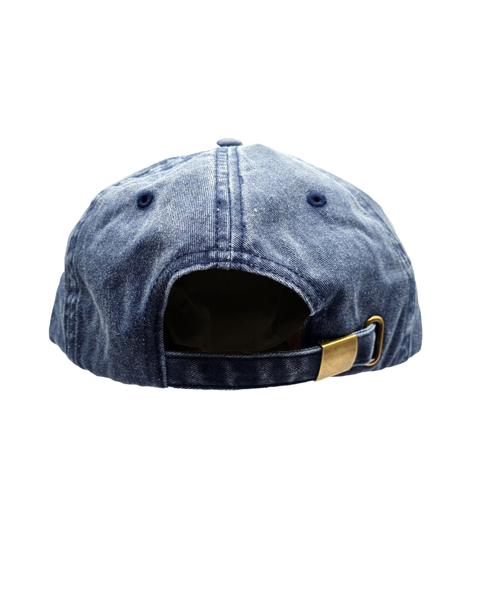 Blue denim cap with a brass buckle on a white background