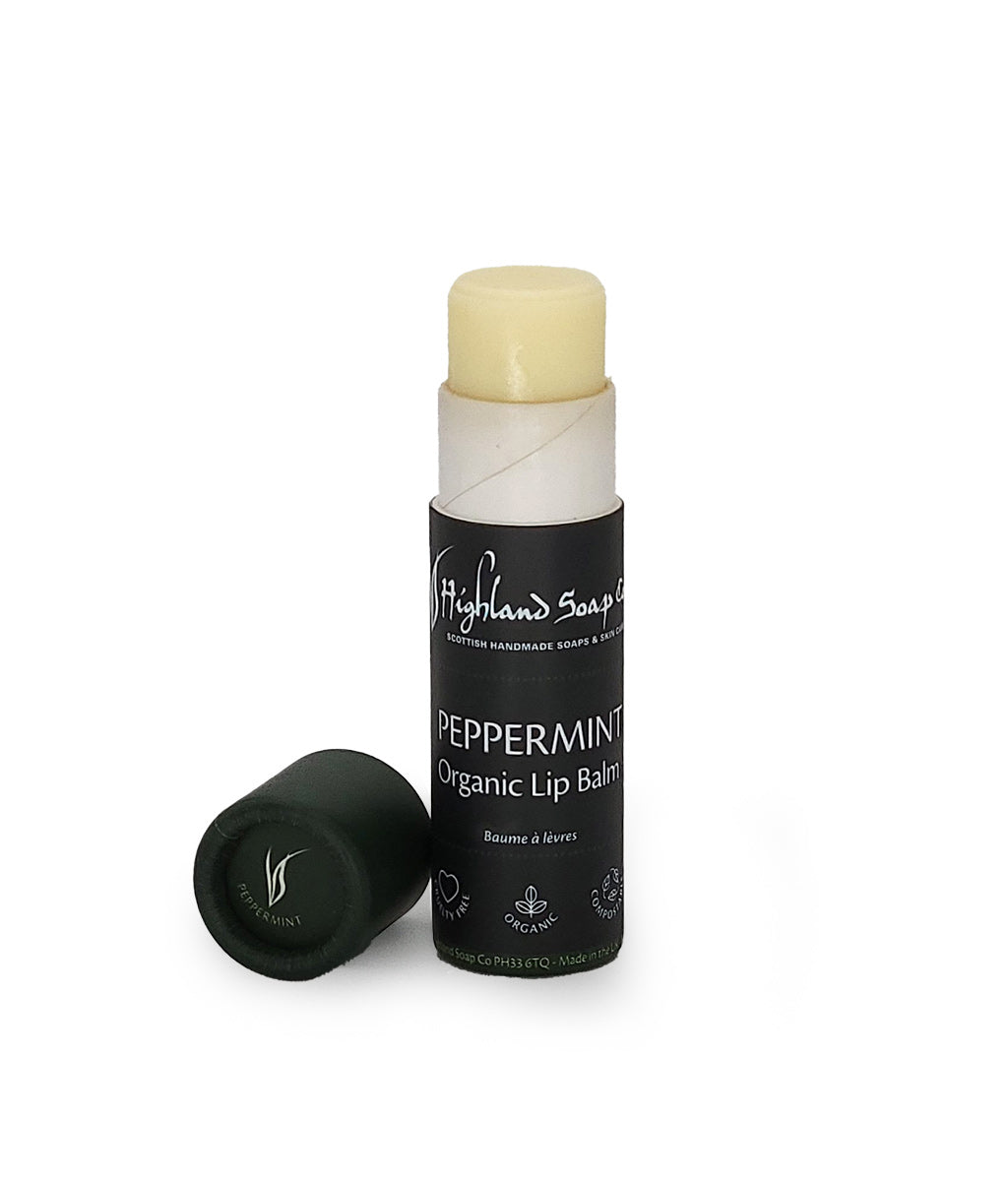 Highland Soap Company Peppermint organic lip balm with black container on a white background