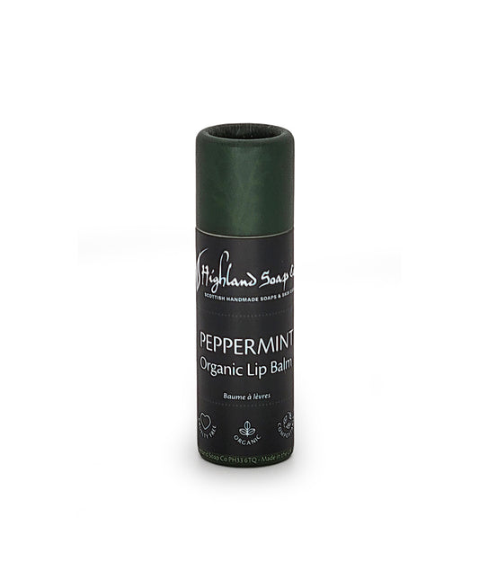 Peppermint organic lip balm by Highland Soap Co. on a white background