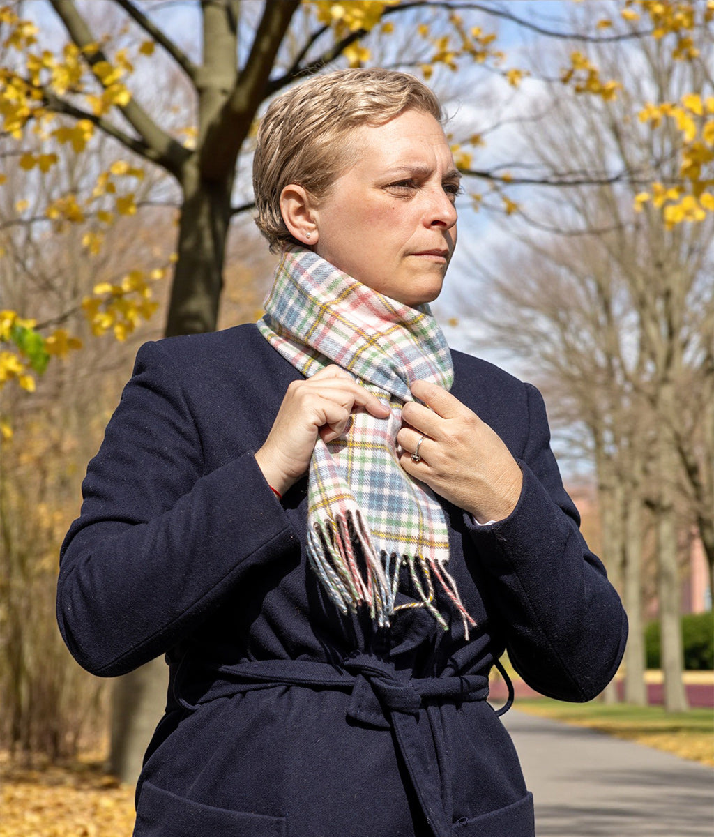 Lady in Autumnal scene wearing a Pink Castle Tartan Cashmere Scarf