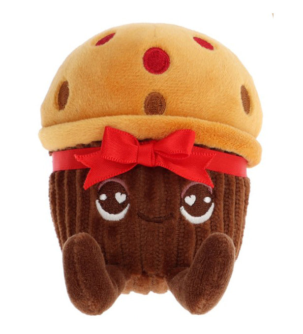 Plush toy resembling a chocolate cupcake with a red bow on a white background