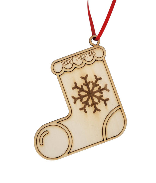 Wooden Christmas stocking ornament with snowflake design on a white background