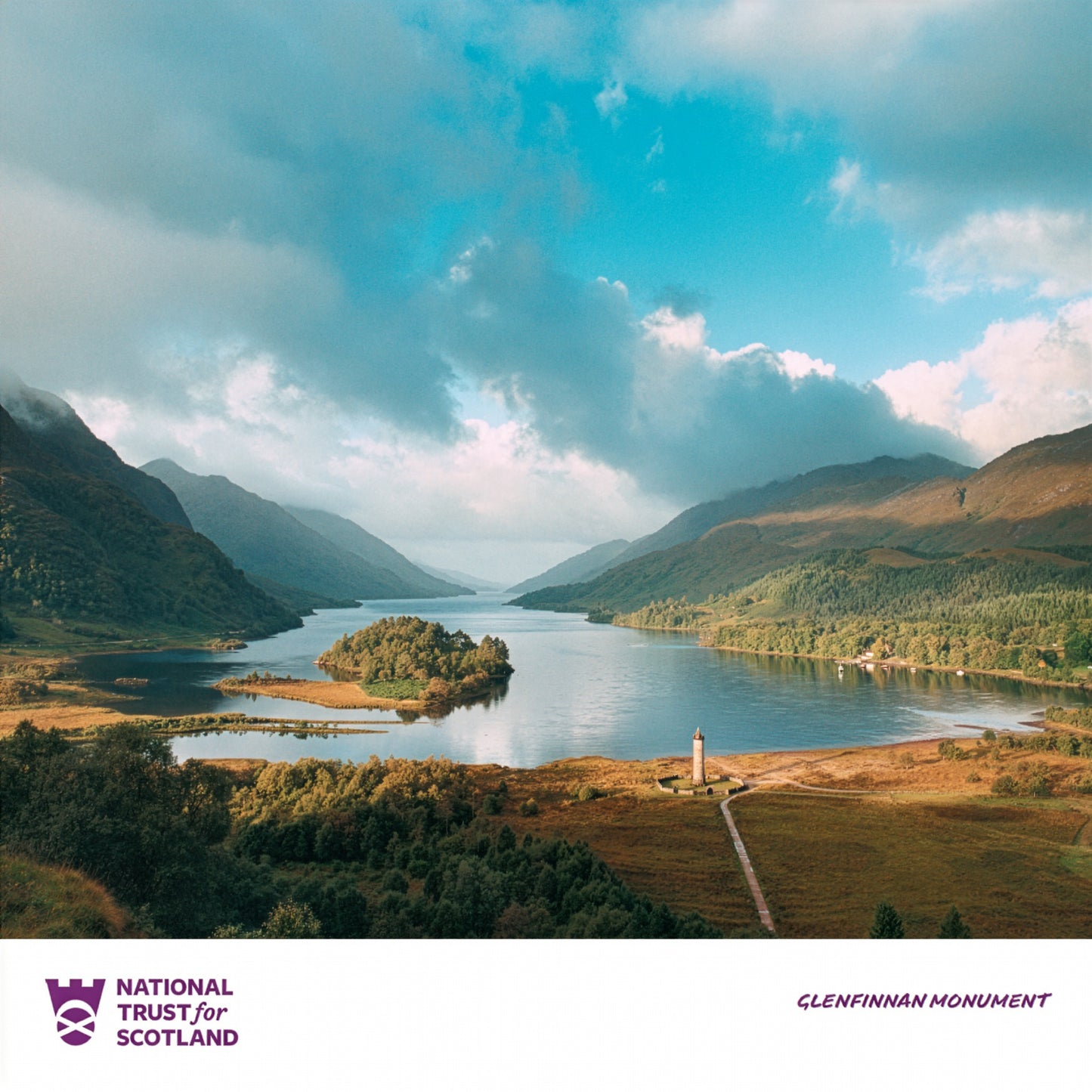 Scenic view of a Glenfinnan with Loch Shiel surrounded by mountains with 'National Trust for Scotland' logo.