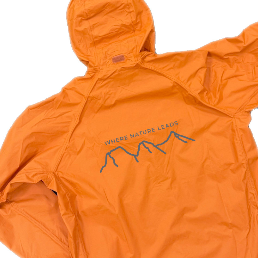 Keela Where Nature Leads Packaway Orange jacket with 'Where Nature Leads' text and mountain graphic on a white background