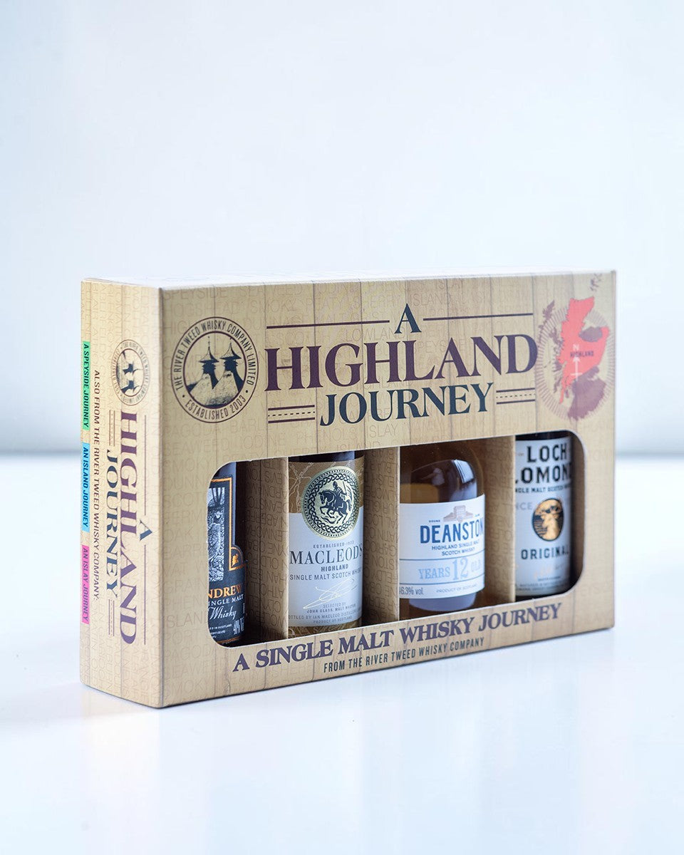 A Highland Journey single malt whisky gift set box containing four bottles, shown on a clean white background.