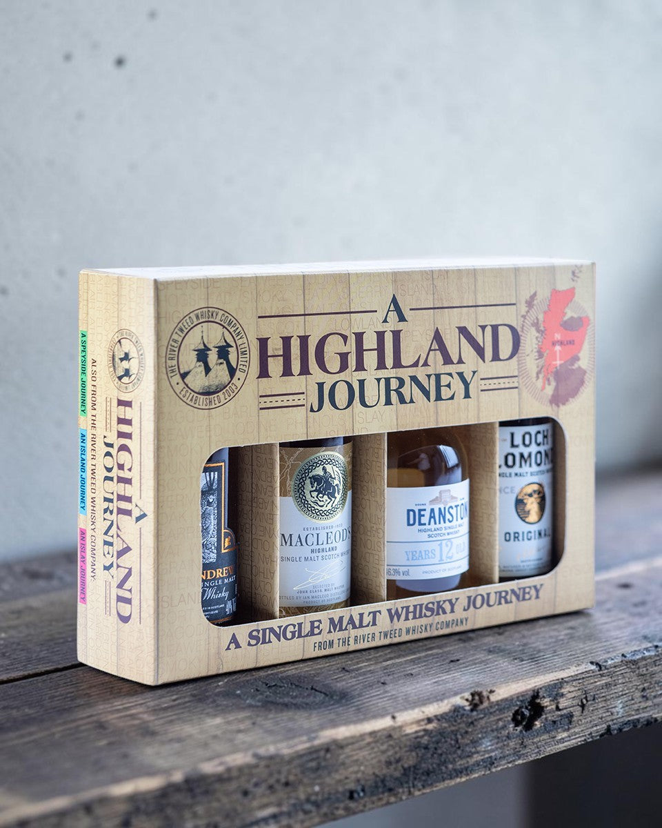 A Highland Journey single malt whisky gift set box containing four bottles, shown on a clean white background.