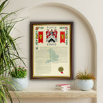 Surname and Coat of Arms History Print mounted in a dark & gold frame.